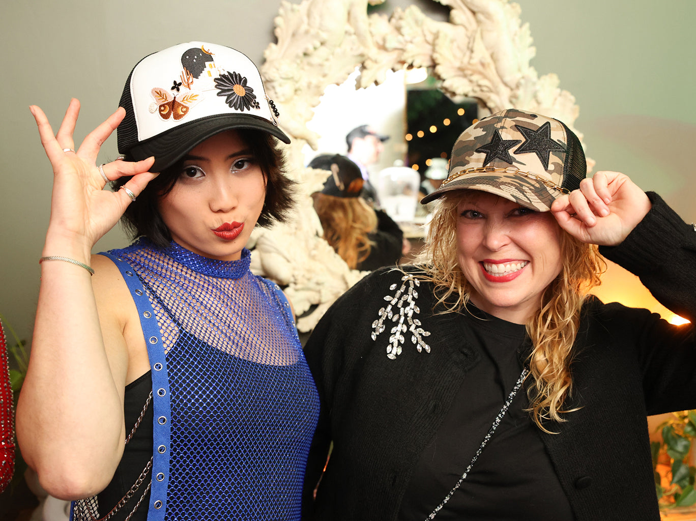 Two beautiful ladies with custom hats created at the har bar